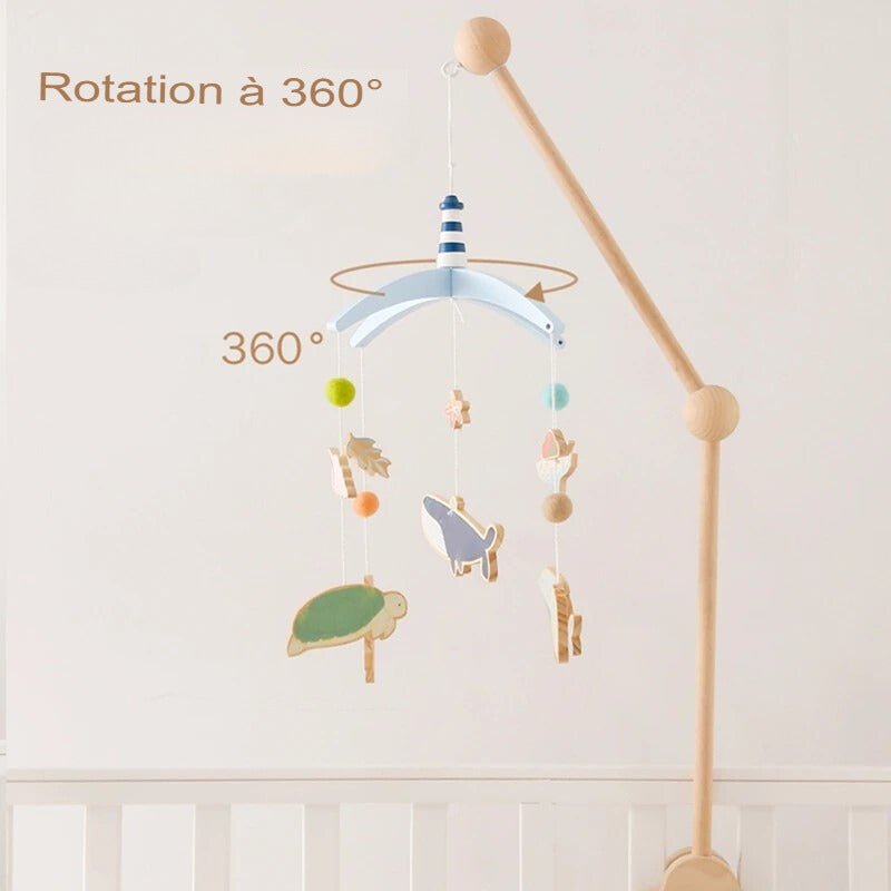 Mobile bébé Océan Magique en rotation à 360°, suspendu au-dessus d'un lit de bébé