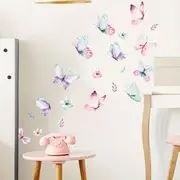 Papillons en vinyle multicolores collés sur un mur rose de chambre de fille – Design enchanté avec ButterfliesSticker™