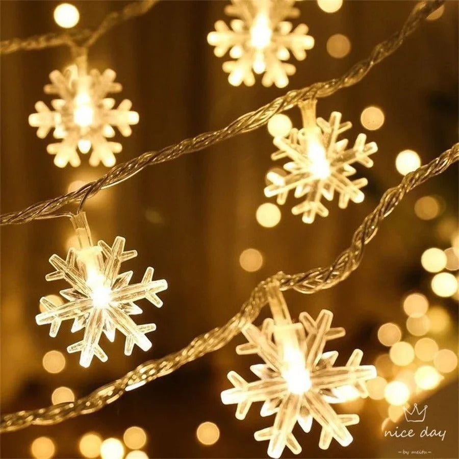 Lumière de Noël flocons dorés et blancs pour ambiance festive chaleureuse