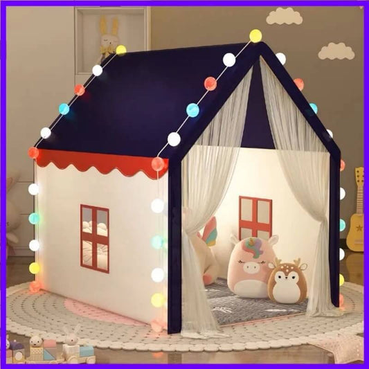 Tipi Enfant Petit Royaume™ couleur bleue installé dans une chambre avec jouets