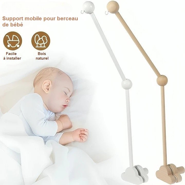 Support mobile bébé LittleCloud en bois naturel installé près d’un berceau, apportant élégance et sécurité à la chambre de bébé."