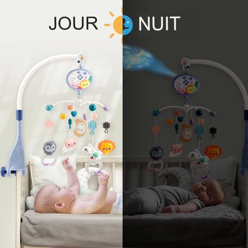 Le bébé joue avec le mobile en jour et la nuit offre des images de lune, d'étoiles et de dessins animés