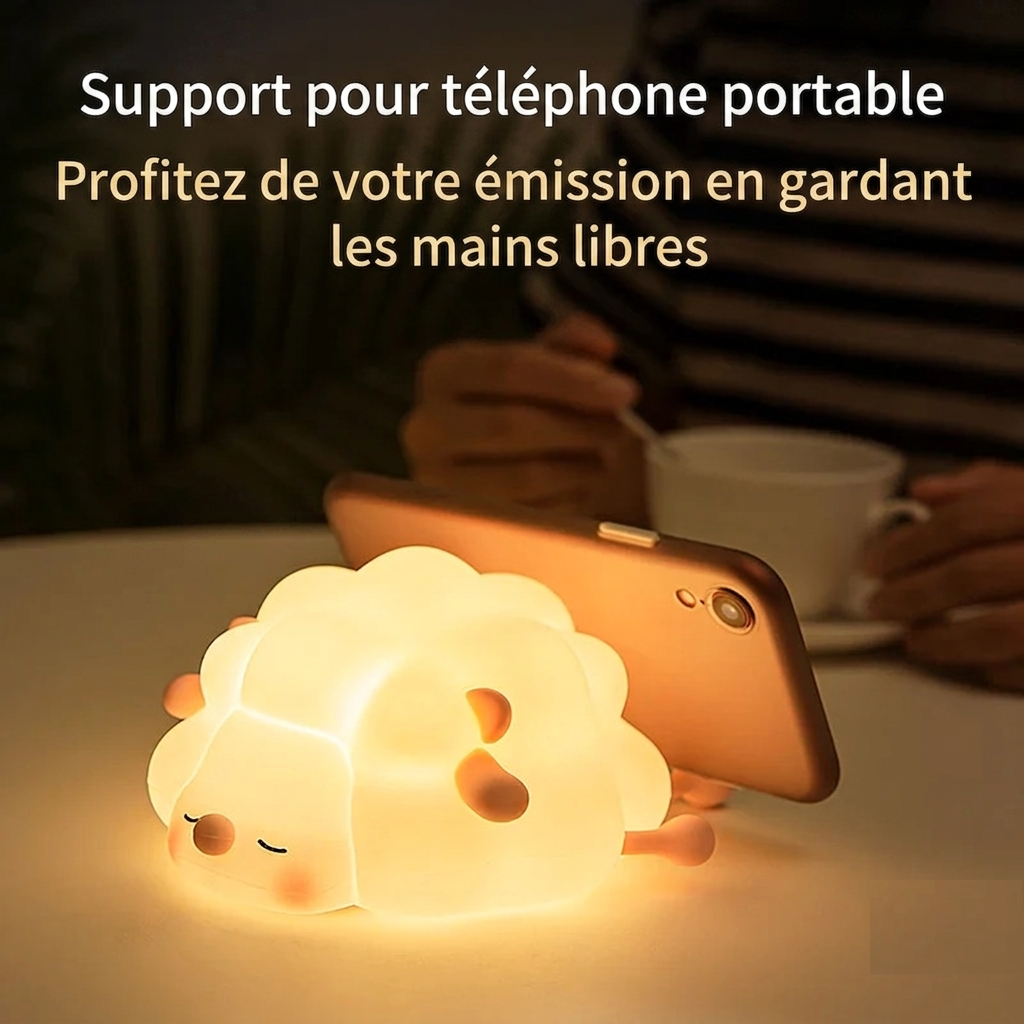 La veilleuse BabyDream™ Sheep utilisée comme support pour smartphone, permettant de regarder des vidéos en gardant les mains libres.
